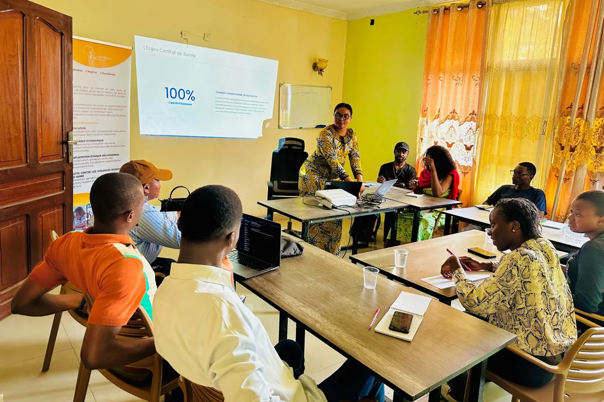 A facilitator leads a group discussion and presentation at the Vijana Campus in Goma